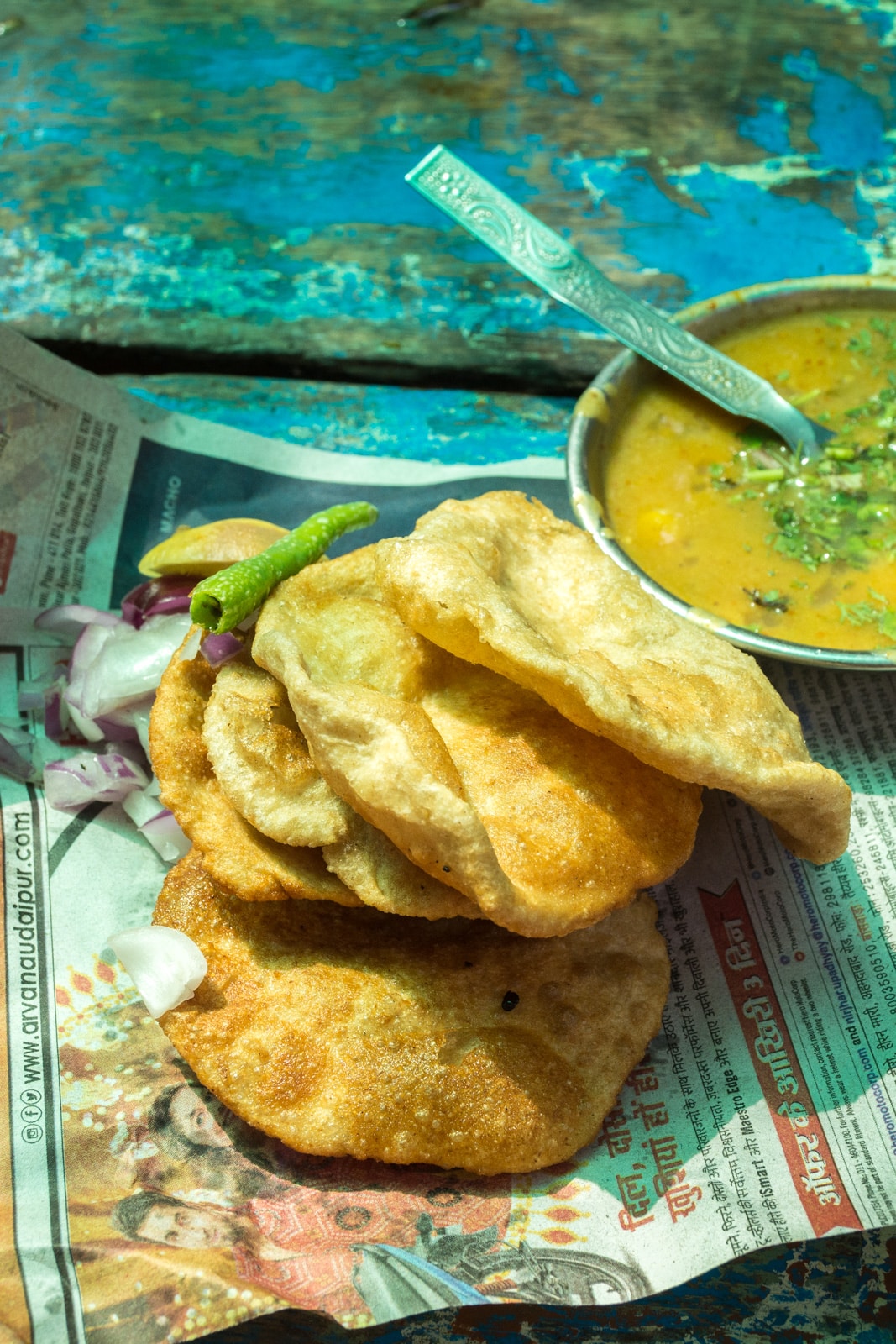 Fresh puri on a newspaper on the streets of Udaipur, Rajasthan state, India.