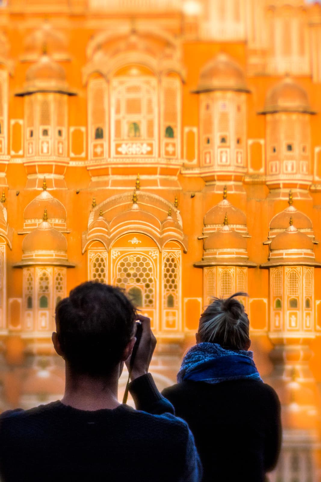 Tourists taking photos in front of the Hawa Mahal in Jaipur, Rajasthan state, India.