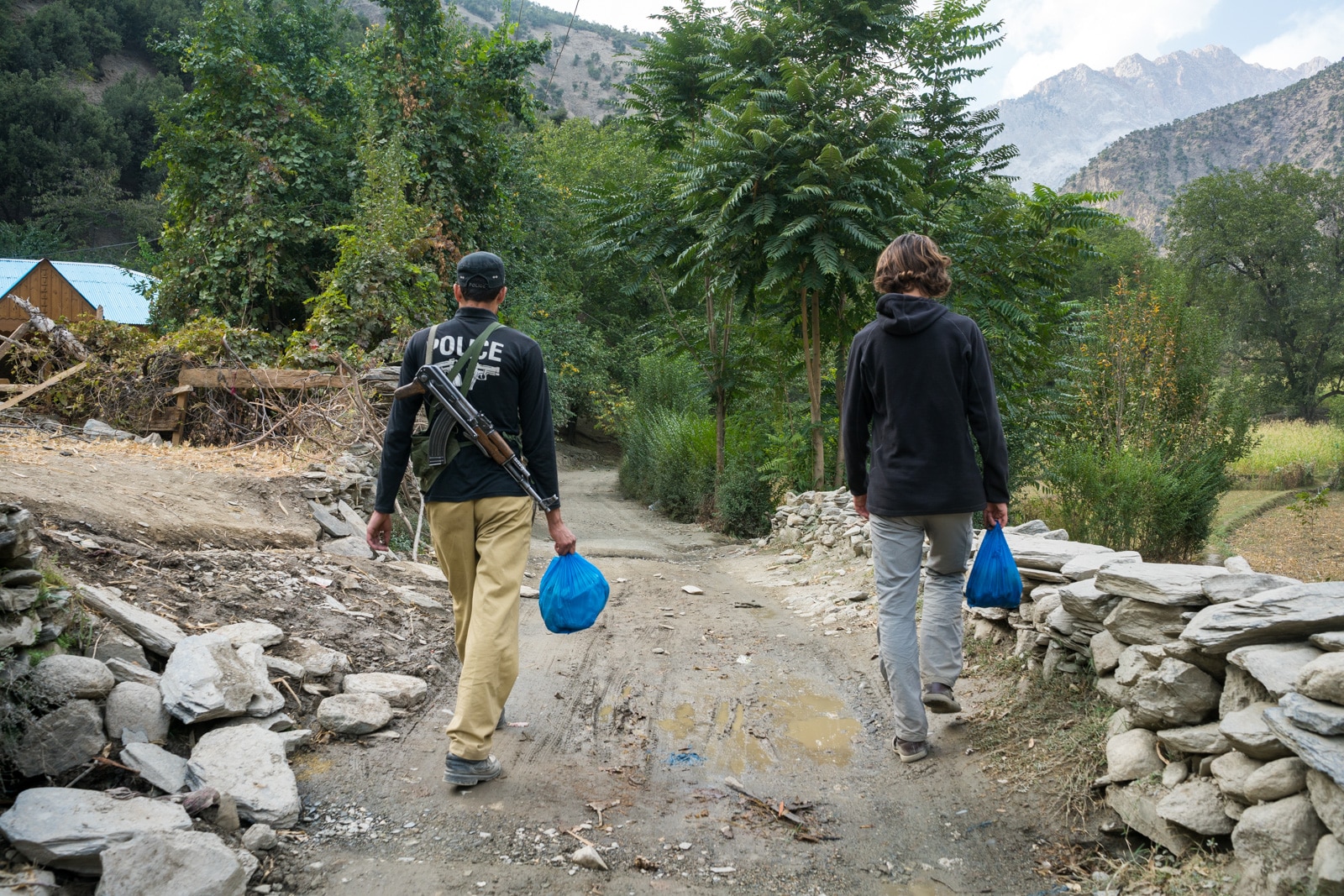 How to get from Chitral to Kalash Valleys in KPK, Pakistan - Foreigner security police escort in Kalash Valley - Lost With Purpose travel blog