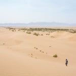 Wandering in the sand dunes in the desert town of Farahzad, Iran