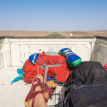 Riding in the back of a pickup truck on the longest border crossing in the world