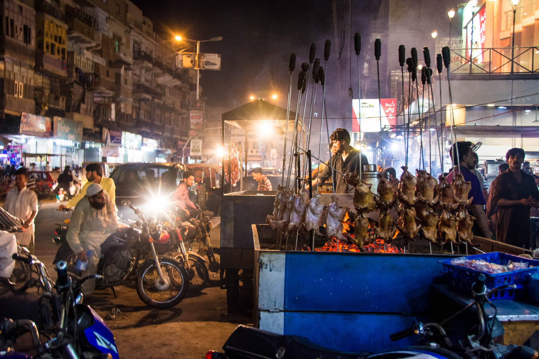 A street food stall selling chicken in Karachi