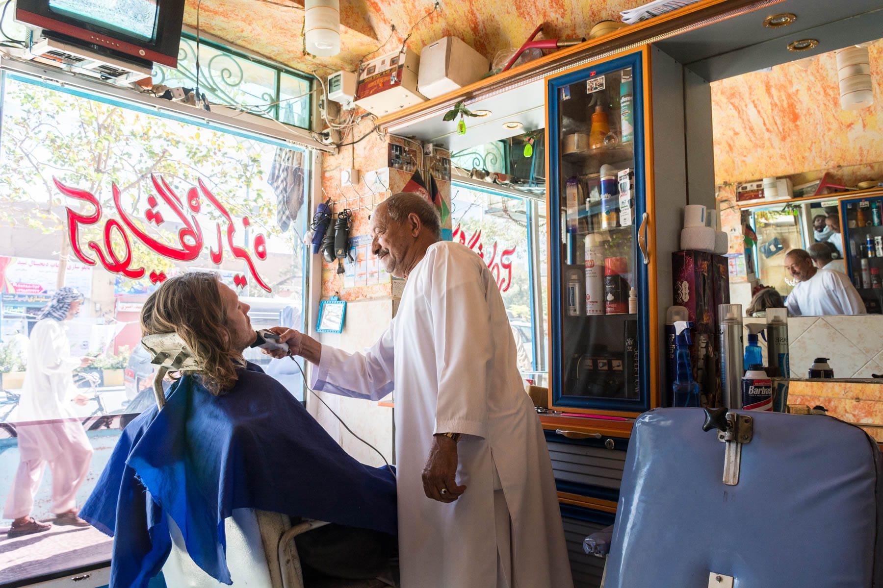 Man getting a shave in Herat, Afghanistan