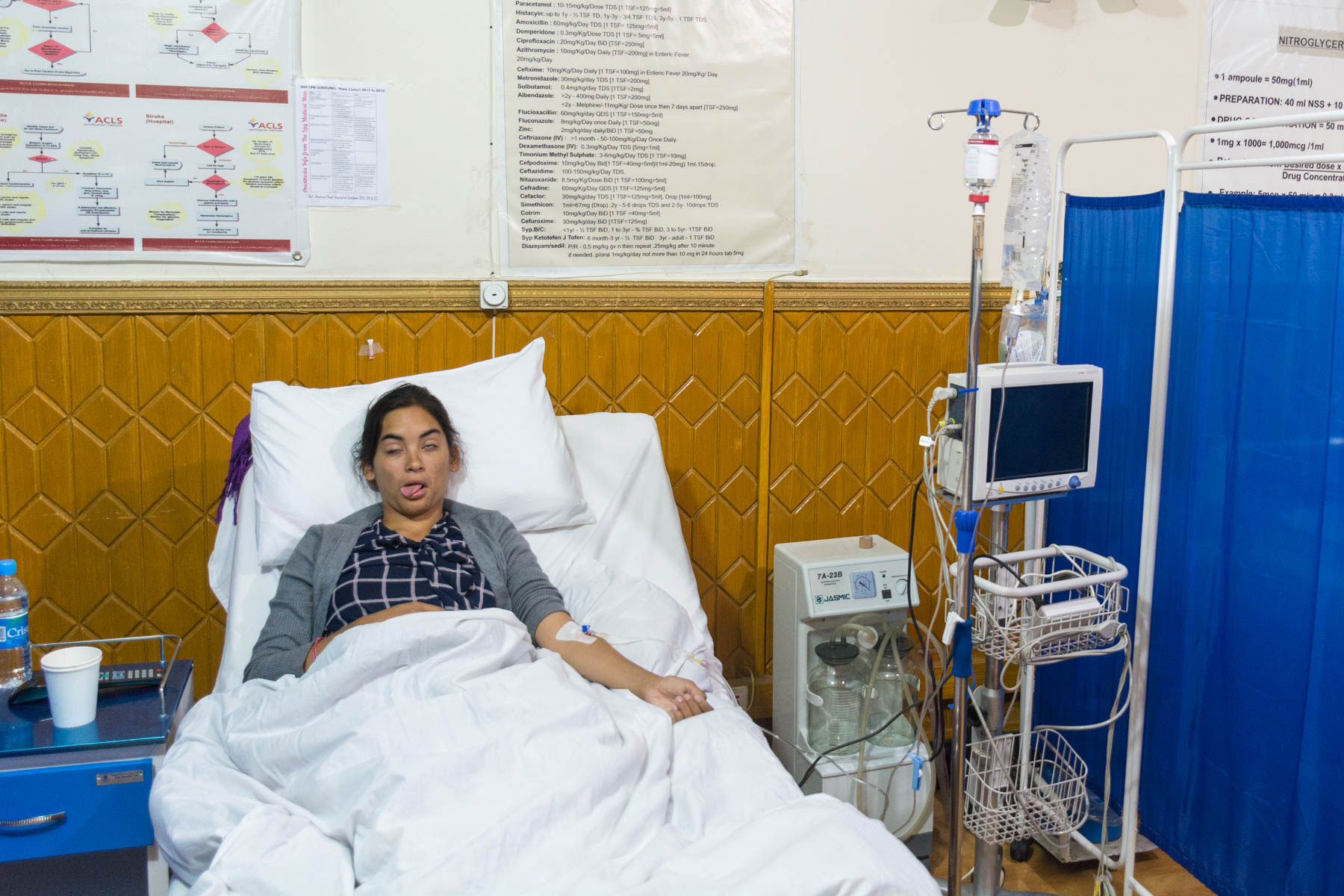 A woman in a private clinic bed in Kabul, Afghanistan