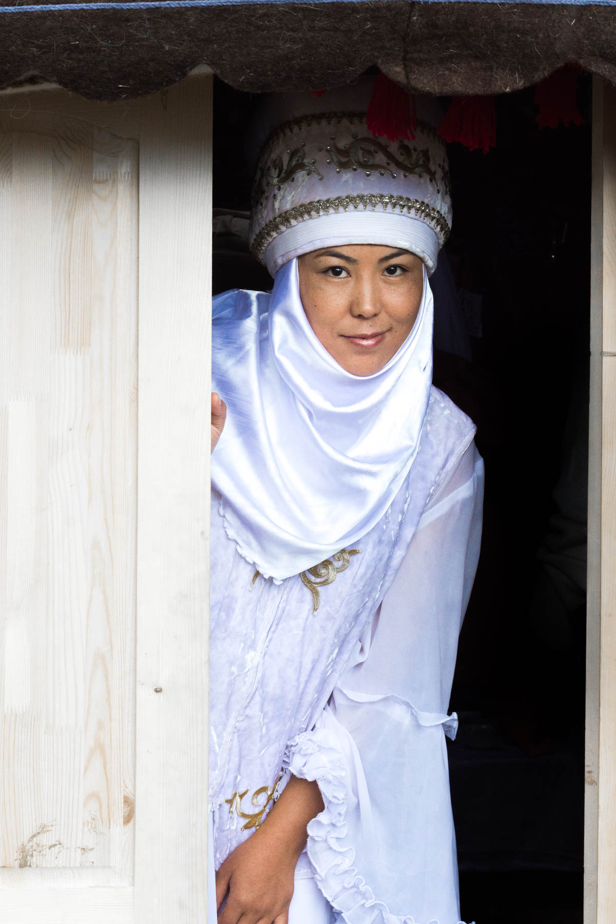 A Kyrgyz nomad girl in traditional clothes at the World Nomad Games