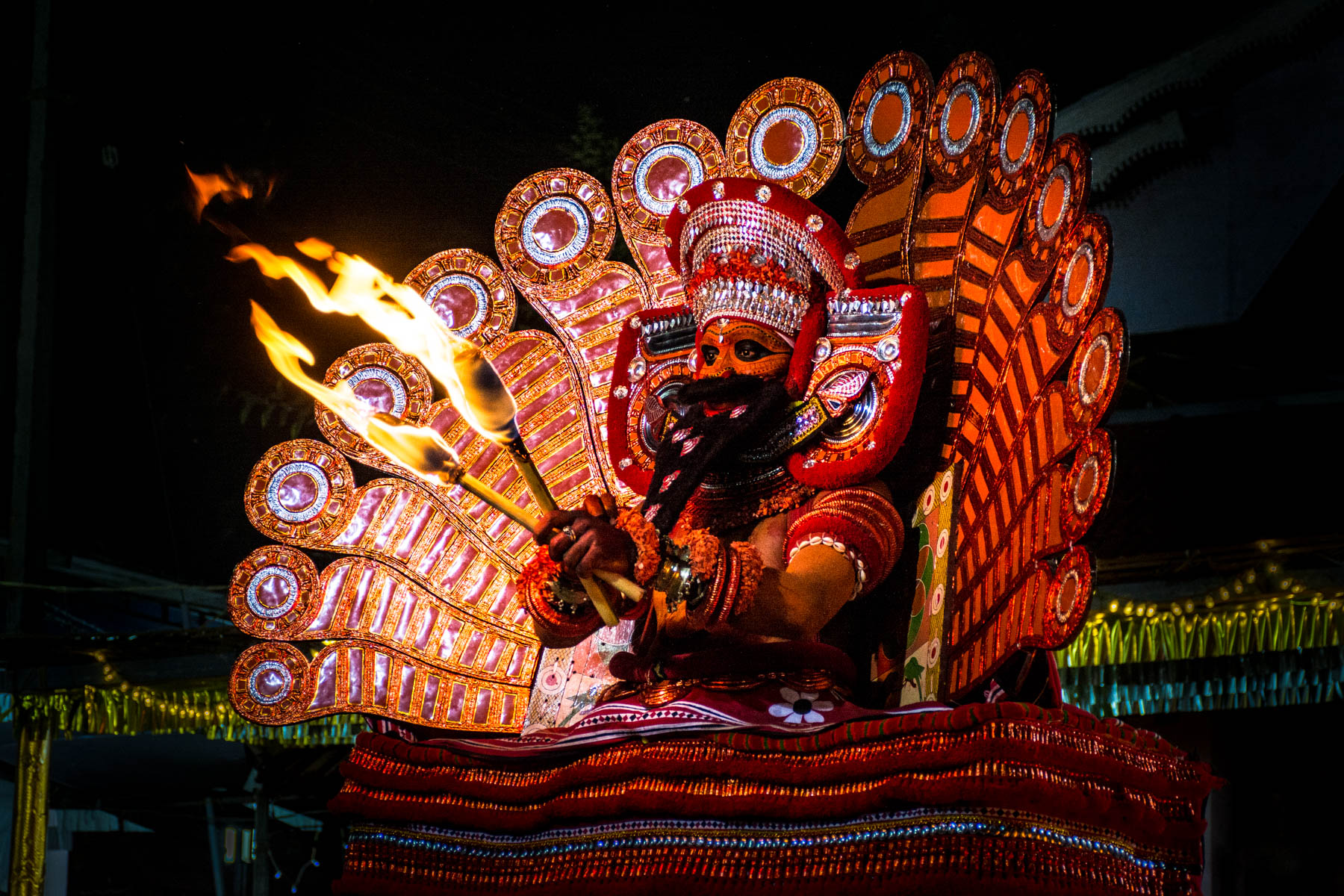 A Theyyam performer dancing in full trance