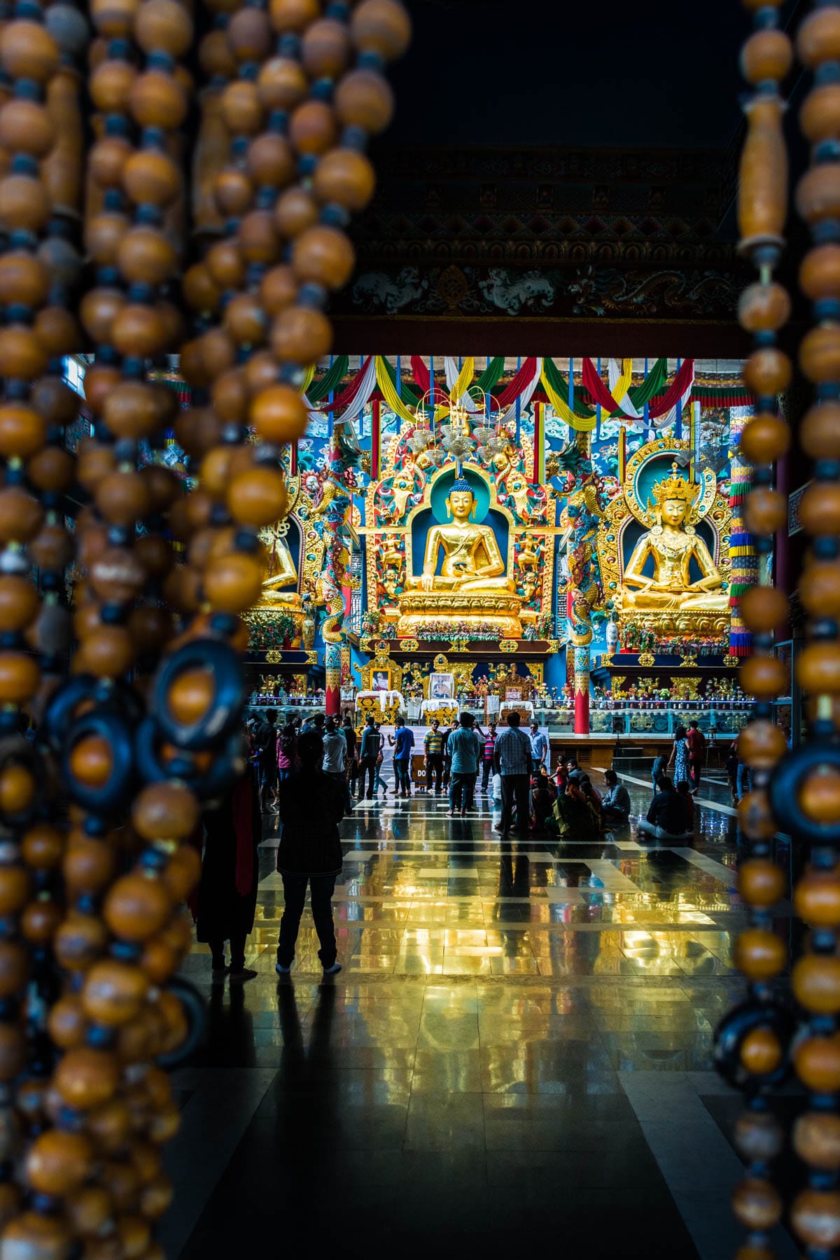 The interior of Namdroling Monastery (AKA the Golden Temple), a Buddhist monastery in Bylakuppe, India's second largest Tibetan settlement. Bylakuppe is a great destination to visit if you're looking for off the beaten track places in Karnataka state!