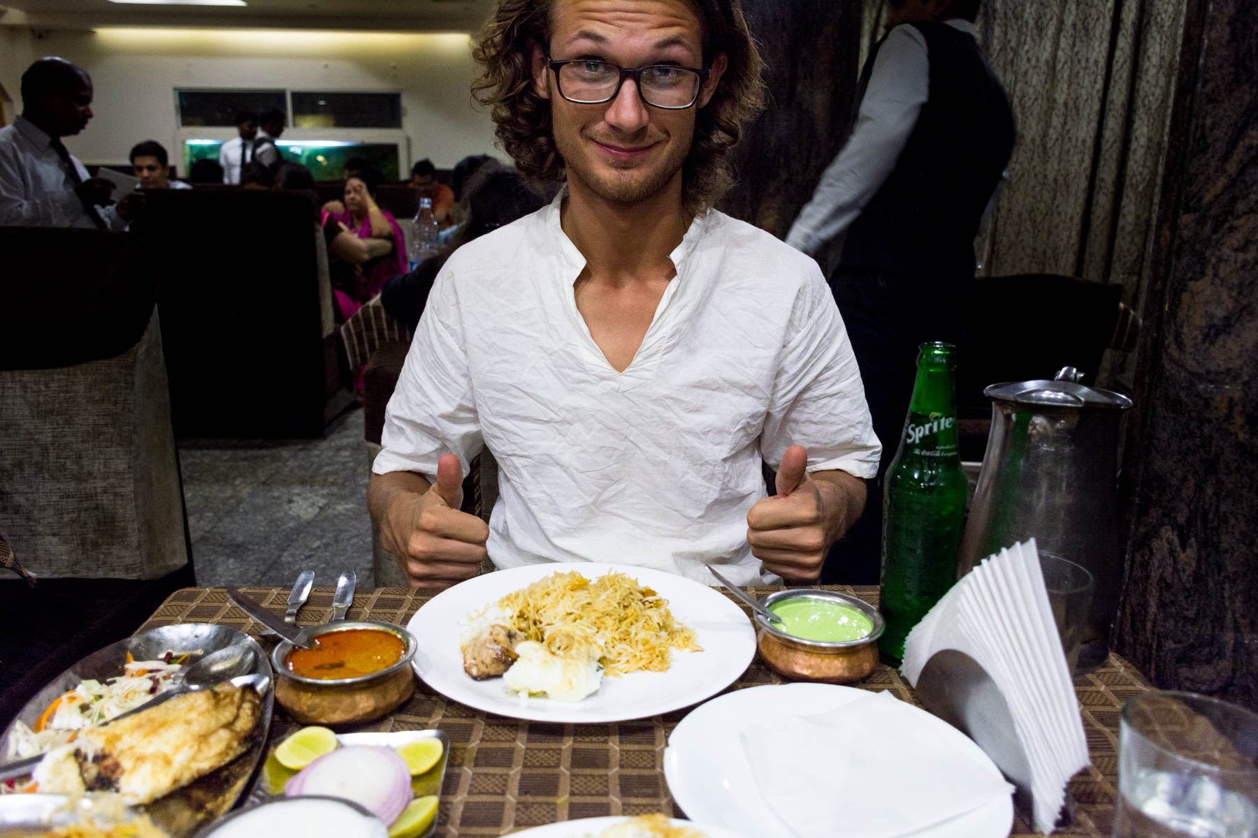 Where and what to eat in Hyderabad's Old City - Sebas eating biryani at Hotel Shadab in Hyderabad, India - Lost With Purpose