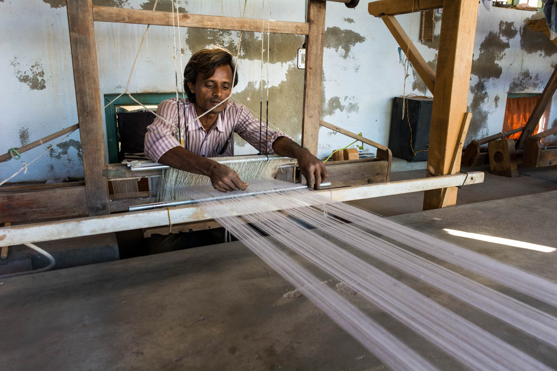 Textiles and crafts of Kutch, Gujarat, India - A local weaver at his loom in Bhujodi - Lost With Purpose