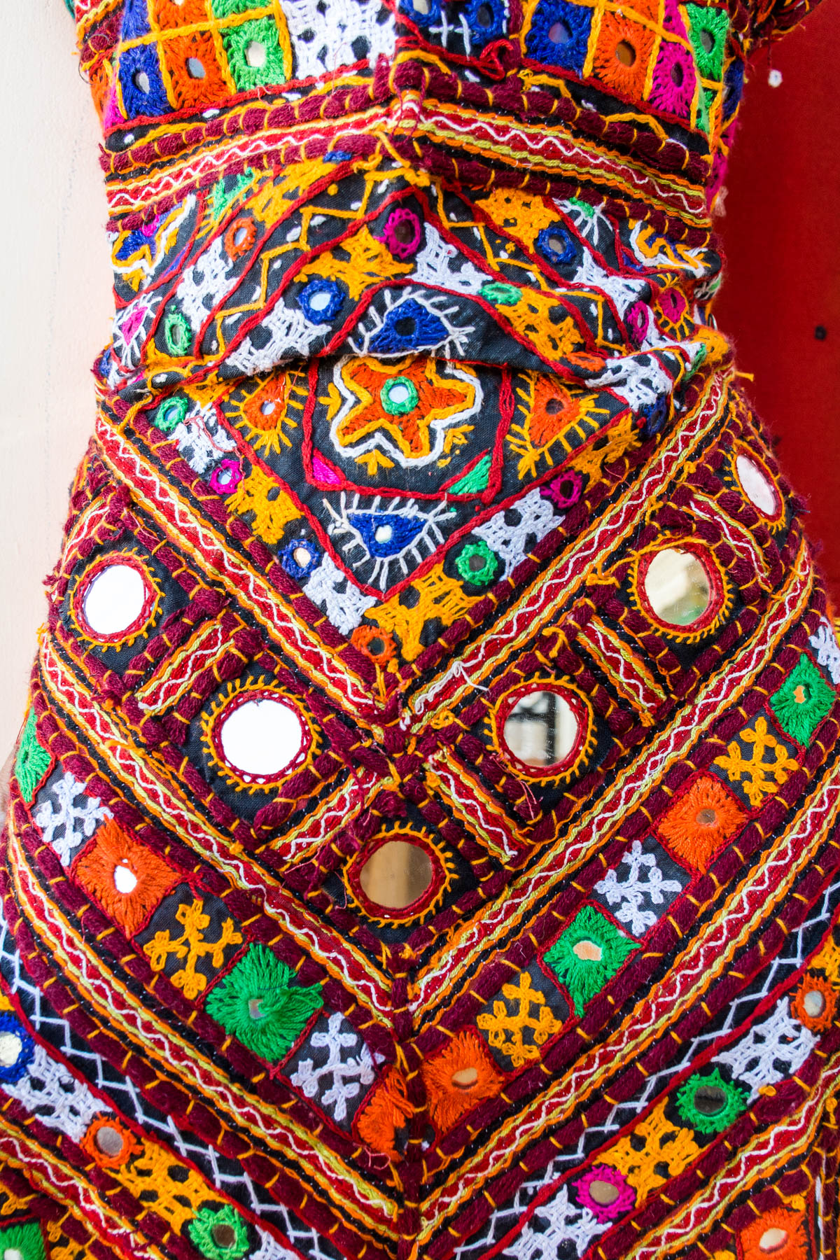 Traditional embroidered Kutch dress material with plenty of mirror work in Bhujodi, a small town in the Kutch region of Gujarat, India.