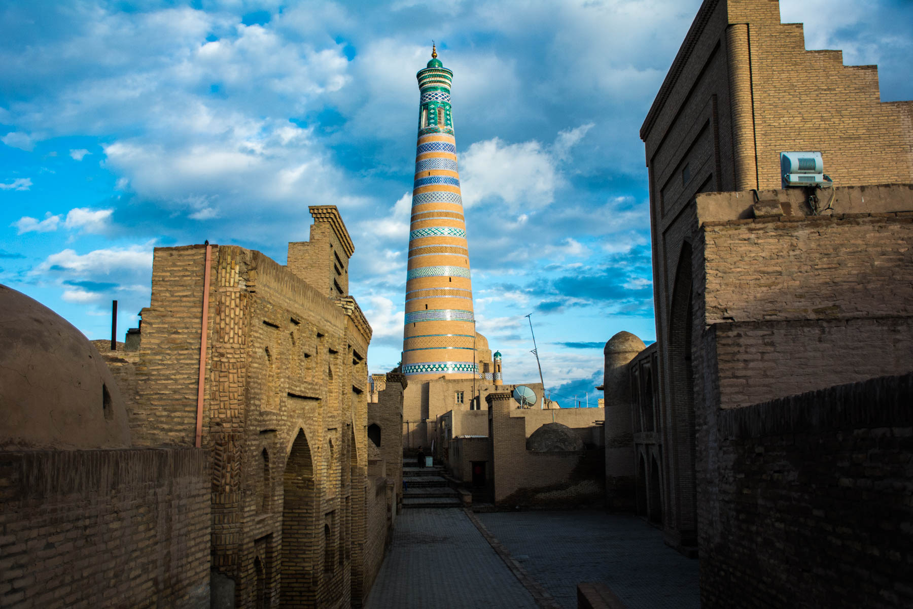 Two week Uzbekistan itinerary - Tura Murad Minaret in Khiva, Uzbekistan after a rain storm - Lost With Purpose