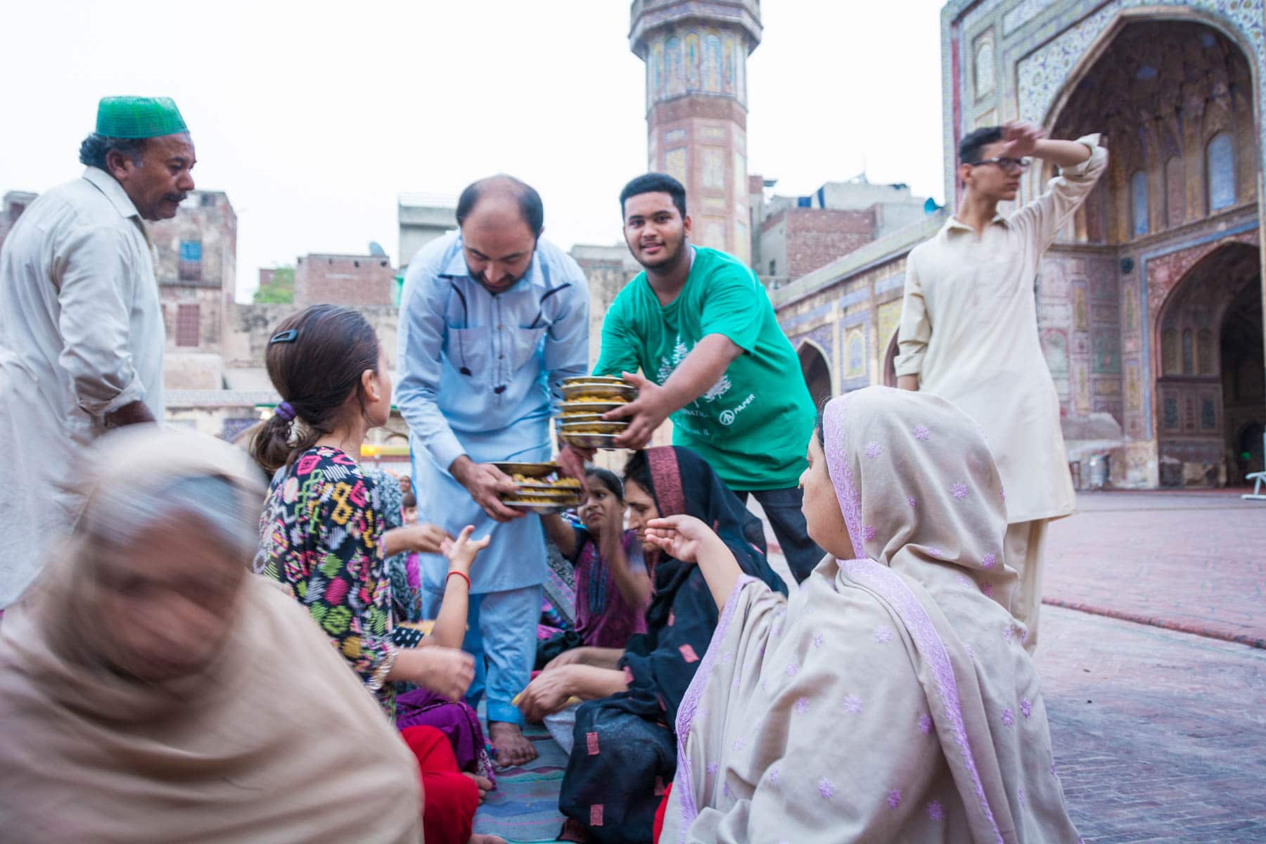 Should I travel in Pakistan during Ramadan - Friendly faces at iftar in Wazir Khan mosque in Lahore, Pakistan - Lost With Purpose