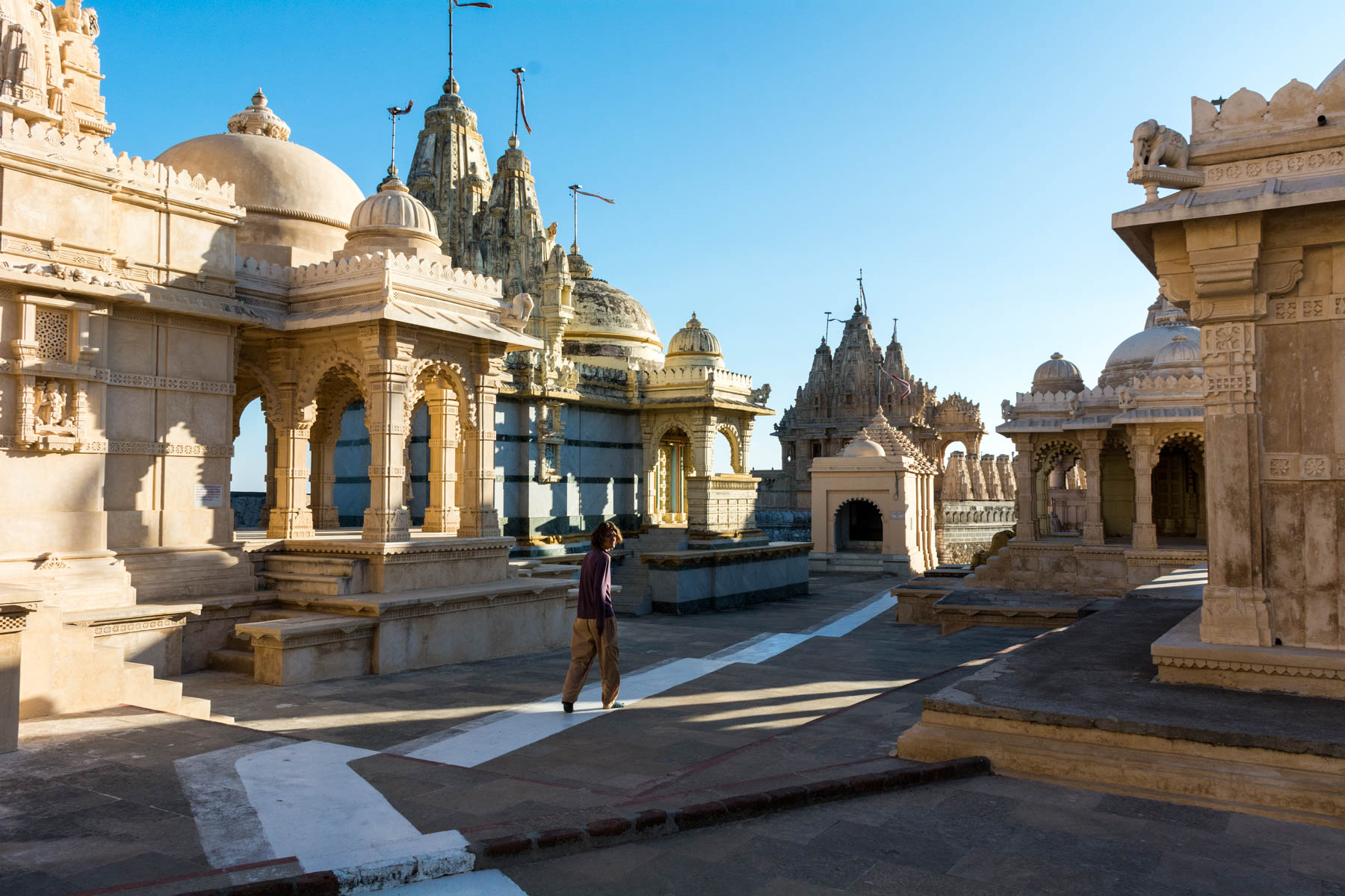 Sunrise at the temples during a Jain pilgrimage in Palitana, India - Lost With Purpose