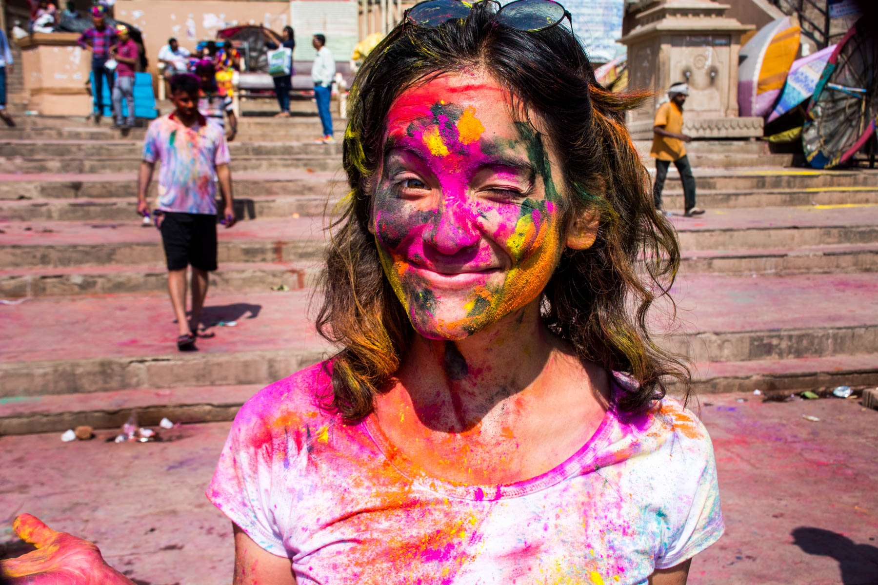 What you need know about playing Holi in Varanasi, India - Alex in a white shirt - Lost With Purpose