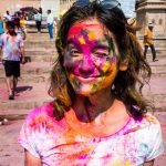 Celebrating Holi as a woman in Varanasi, India - Alex covered with colors - Lost With Purpose