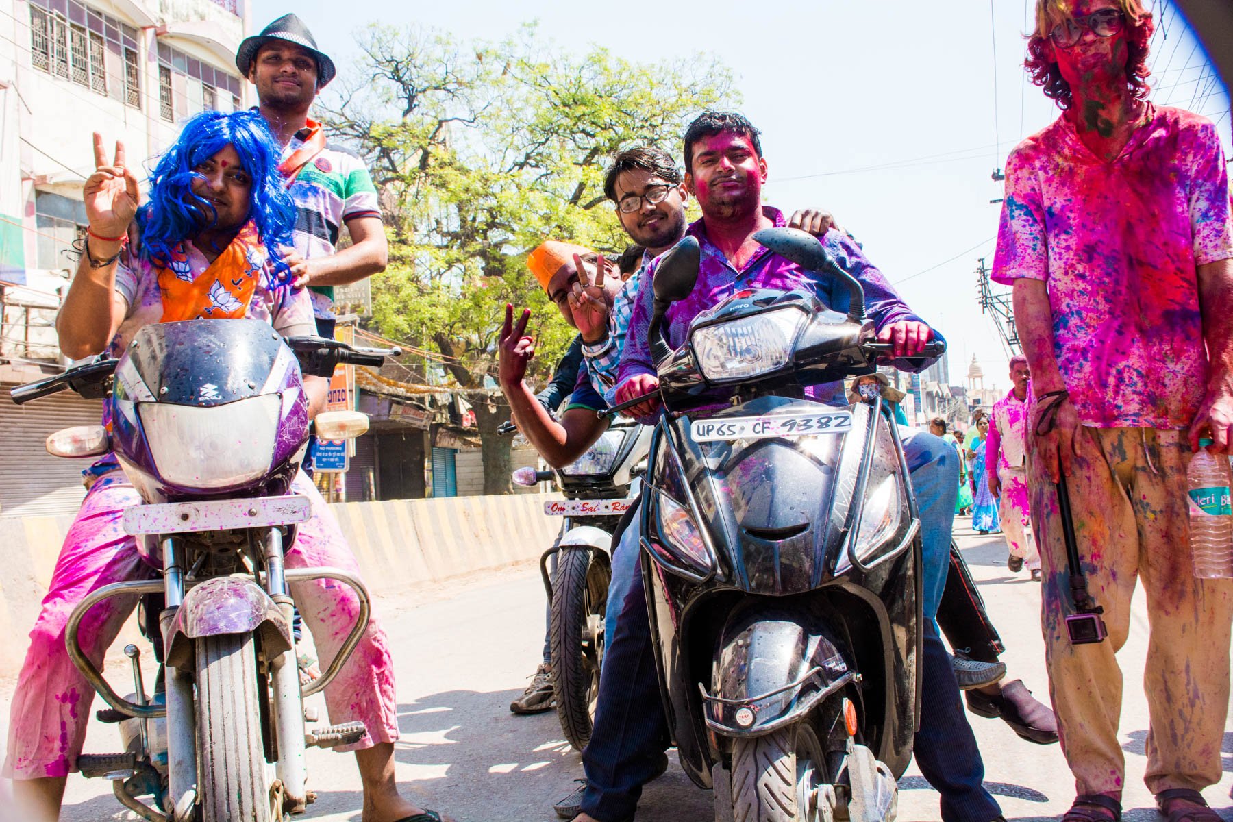 Celebrating Holi in Varanasi as a Female - Jolly drunks on motorbike during Holi in Varanasi - Lost With Purpose