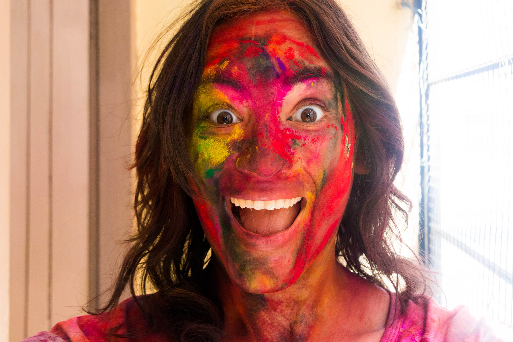 Celebrating Holi as a woman in Varanasi, India - A very painted face - Lost With Purpose