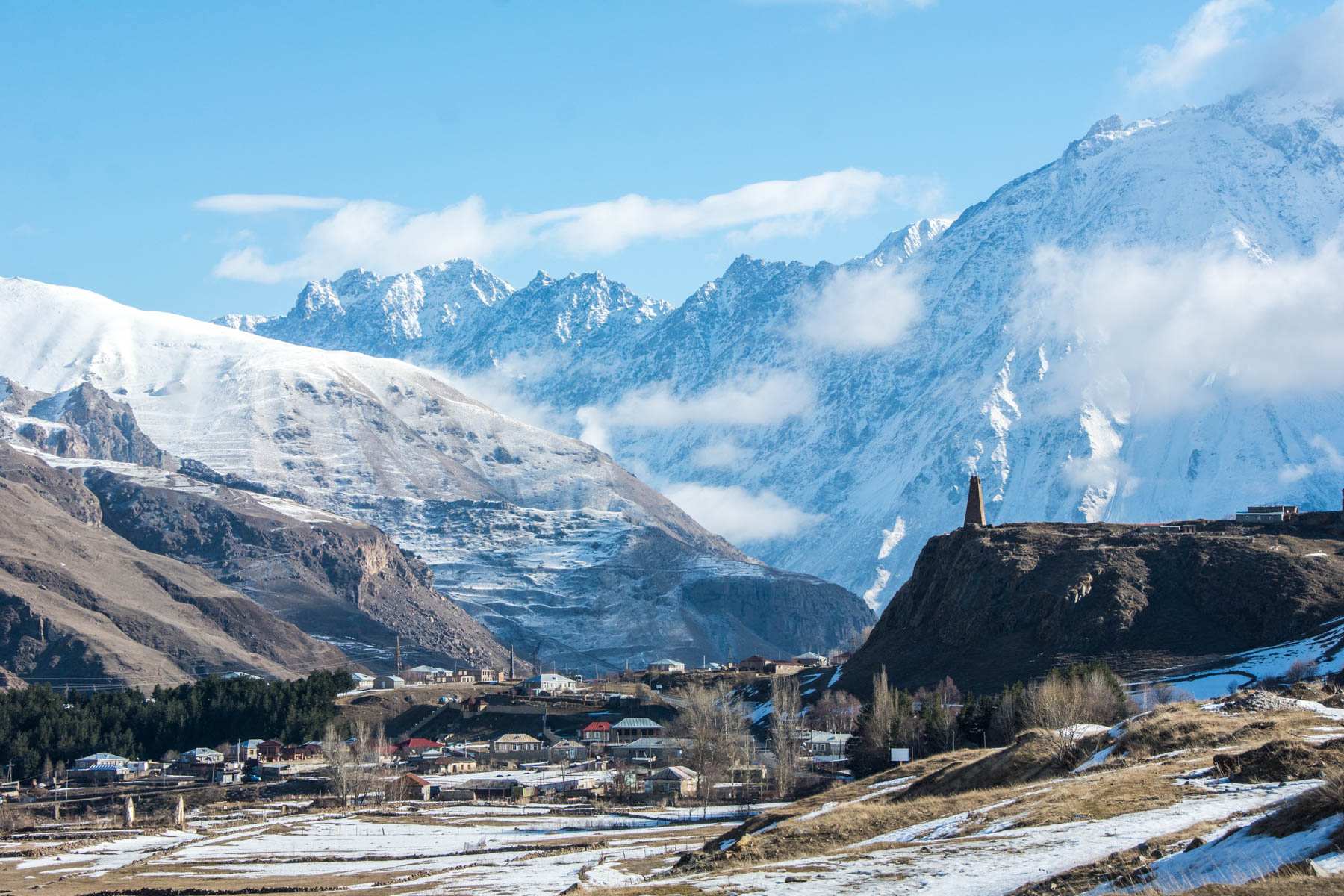 Ways to exercise during long-term travel no matter where you are - Snowy mountains in Kazbegi, Georgia - Lost With Purpose