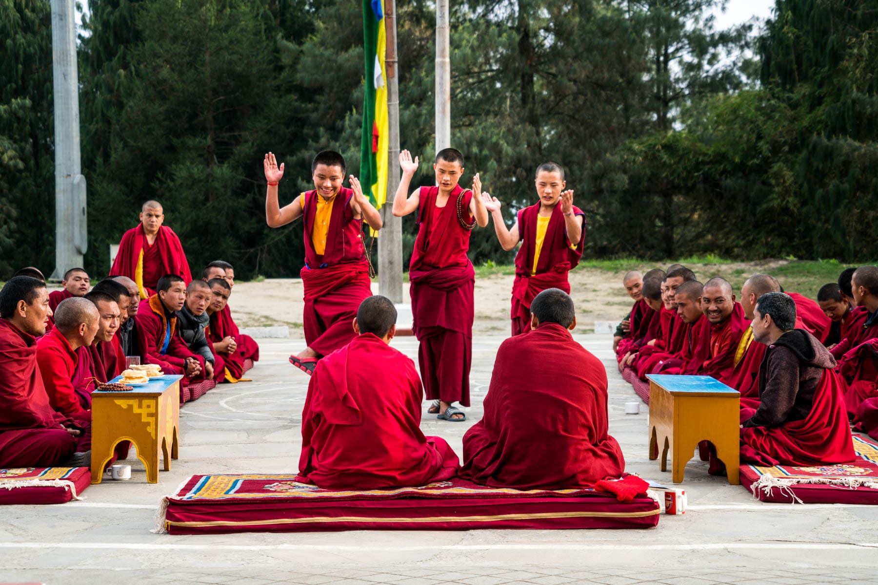 Backpacking in Arunachal Pradesh, India - Buddhist monks practicing Tibetan philosophical debate in Bomdila - Lost With Purpose