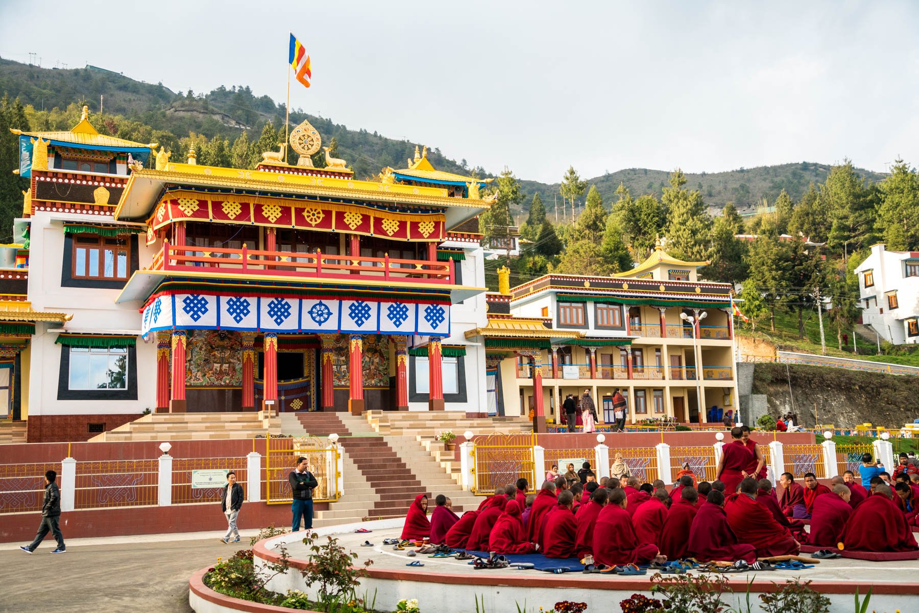 Backpacking in Arunachal Pradesh travel guide - Monks practicing Tibetan philosophical debate outside Upper Gompa - Lost With Purpose