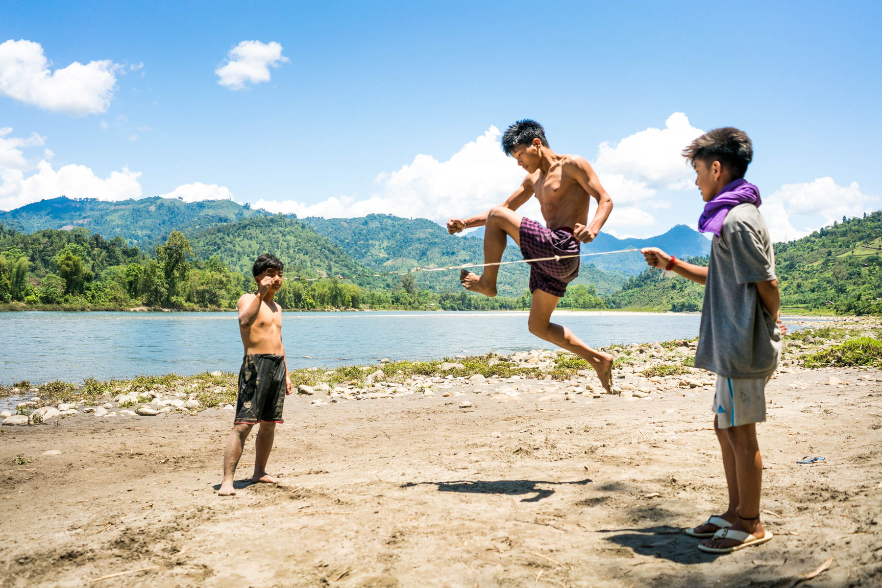 Backpacking in Arunachal Pradesh, India - Local kids in Daporijo showing off their jumping prowess - Lost With Purpose