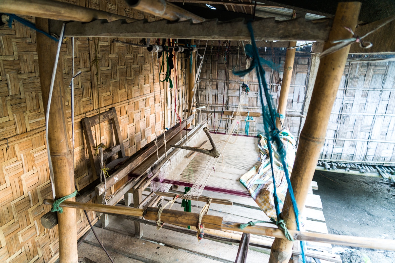 How to get from Sivsagar to Jorhat to Majuli island in Assam, India - A loom at a weaver in Majuli - Lost With Purpose