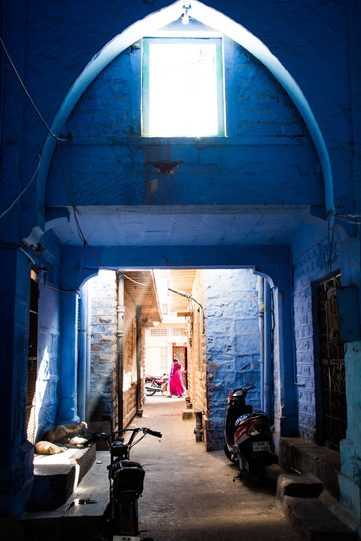 Light beams through a Brahmin blue house on the streets of Jodhpur, Rajasthan, India.