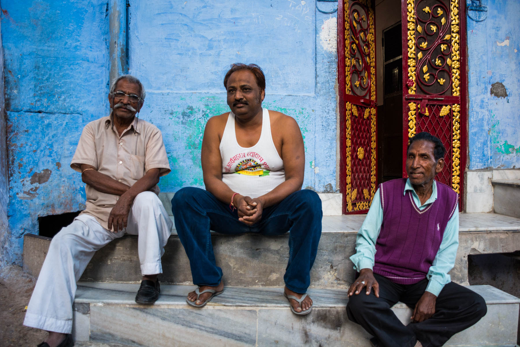 Three men on a stoop in Jodhpur