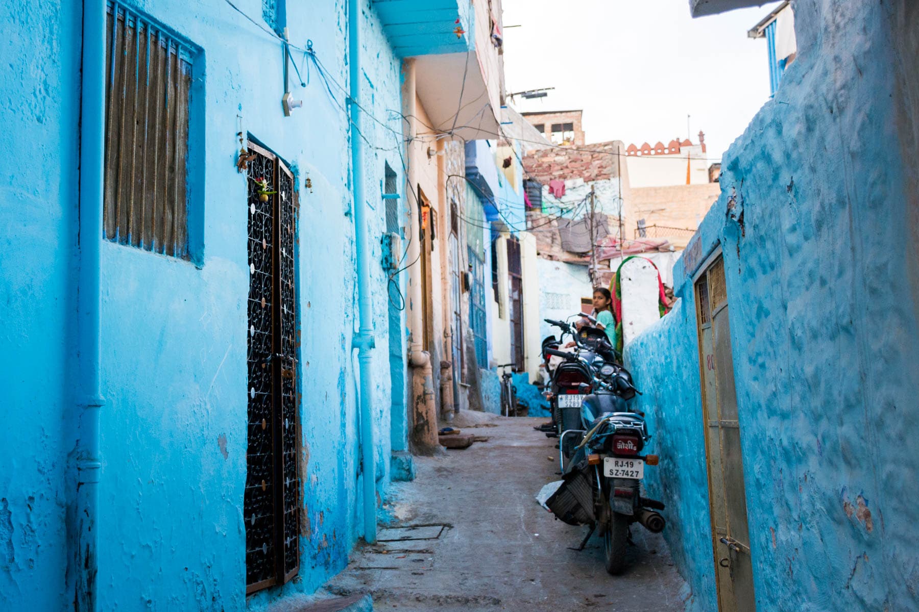 A girl in a blue neighborhood