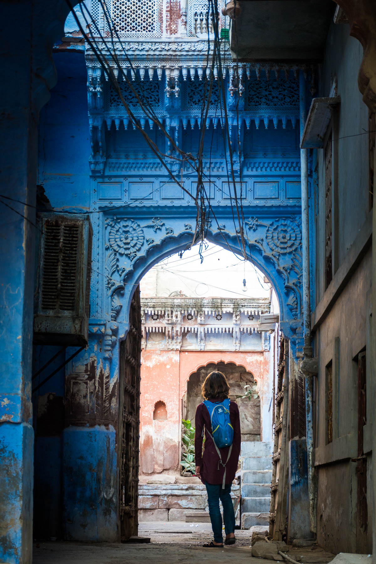 Wandering through one of many blue arches in Jodhpur, Rajasthan, India