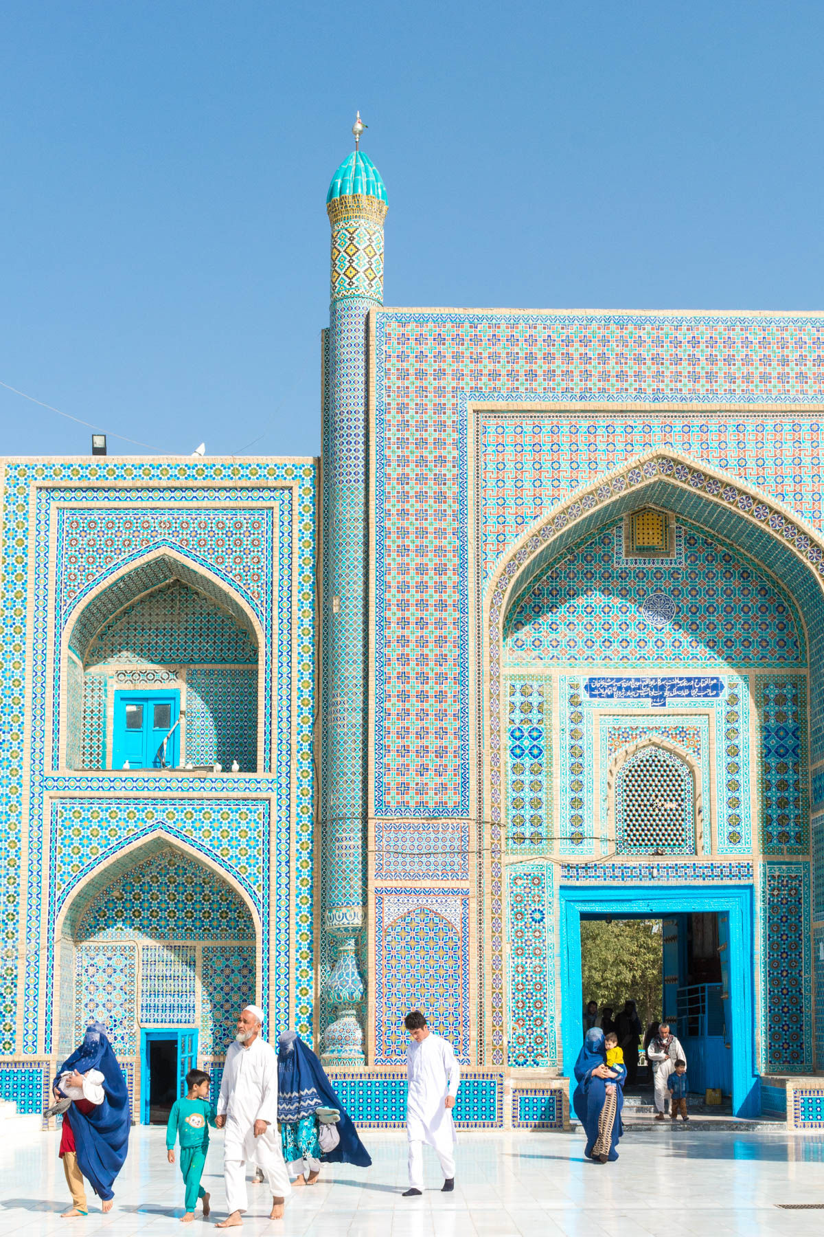 Photos of Mazar-i-Sharif, Afghanistan: An Afghan family walking in the Blue Mosque