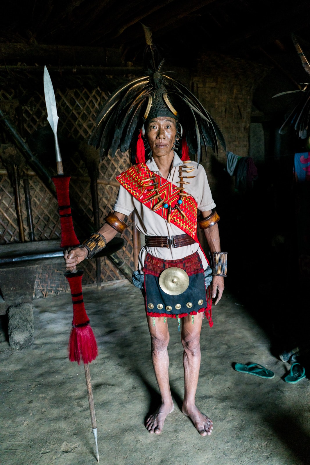 Traditional Naga headhunter dress on a local man in Longwa village, Nagaland, India.