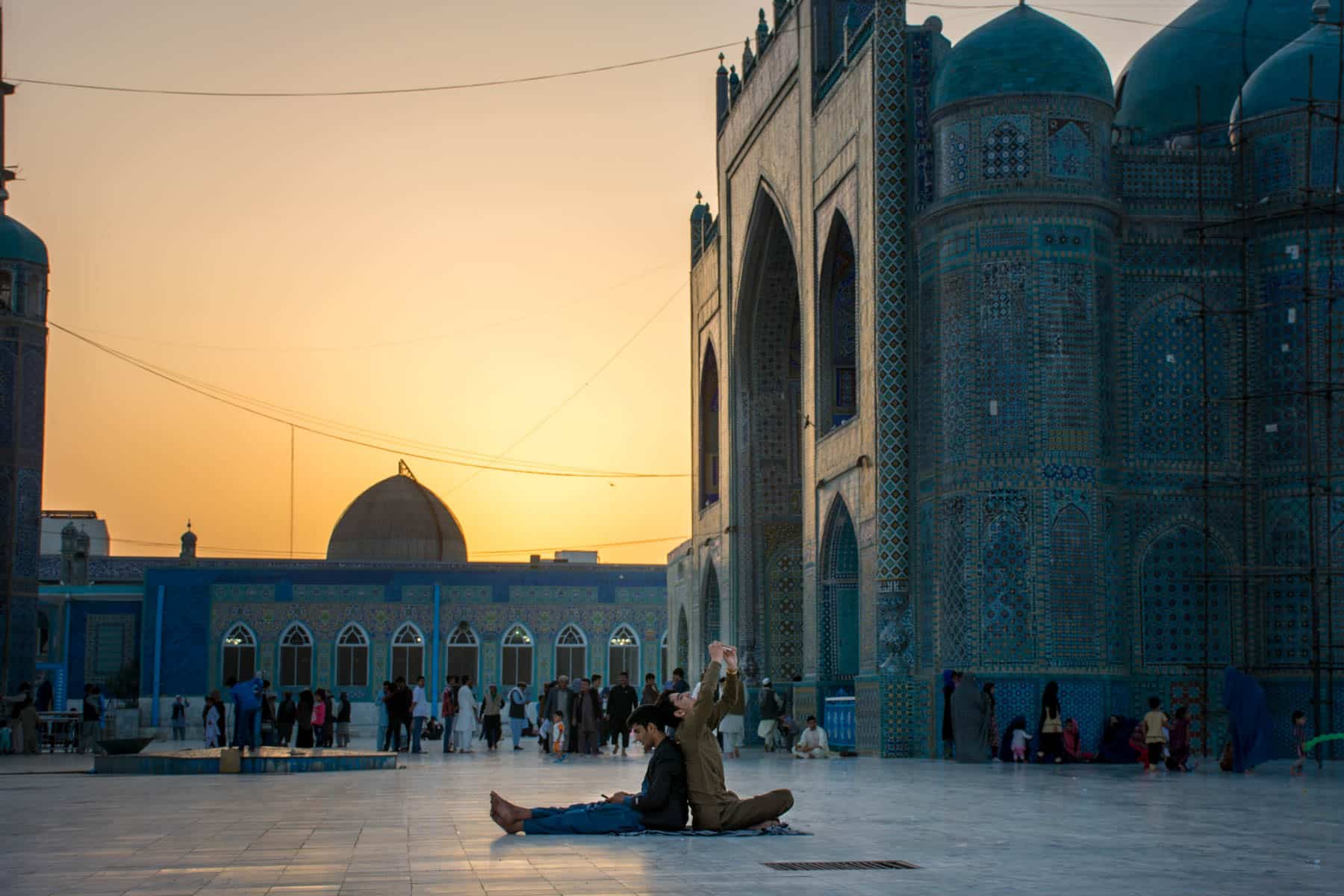 Photos of Mazar-i-Sharif, Afghanistan - Boys taking selfies at sunset at the Blue Mosque - Lost With Purpose