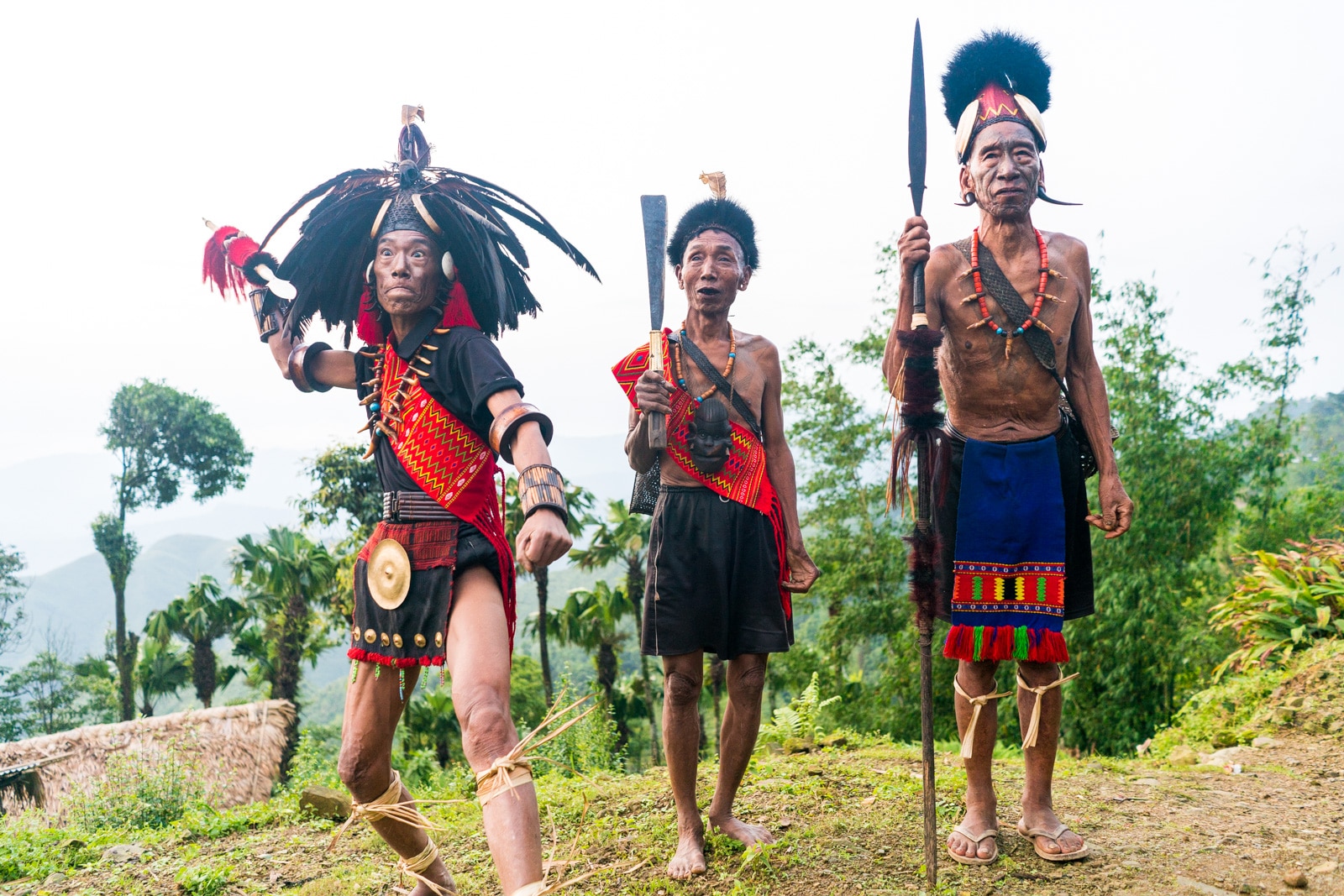 Snapshots of traditional culture in Longwa village, Nagaland, Northeast India - Line of warriors in Longwa - Lost With Purpose Travel Blog