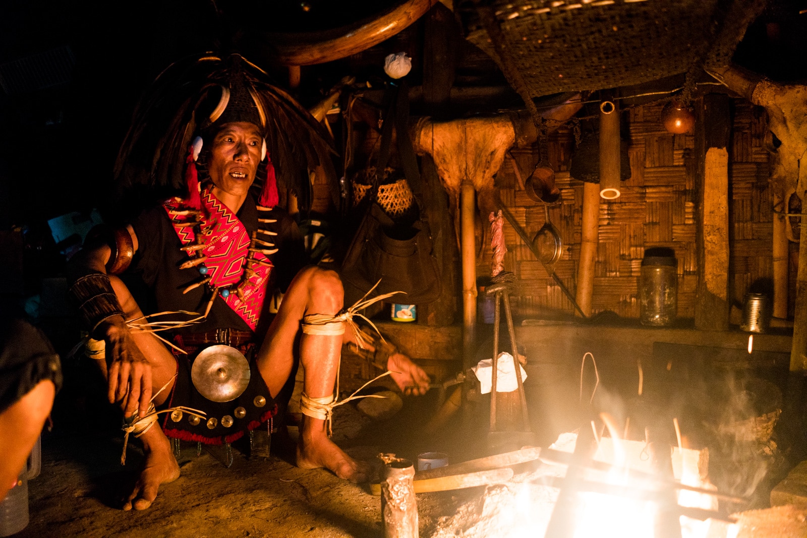 Photos of traditional tribal culture in Longwa village, Nagaland, Northeast India - Longwa tribesman at the fire - Lost With Purpose