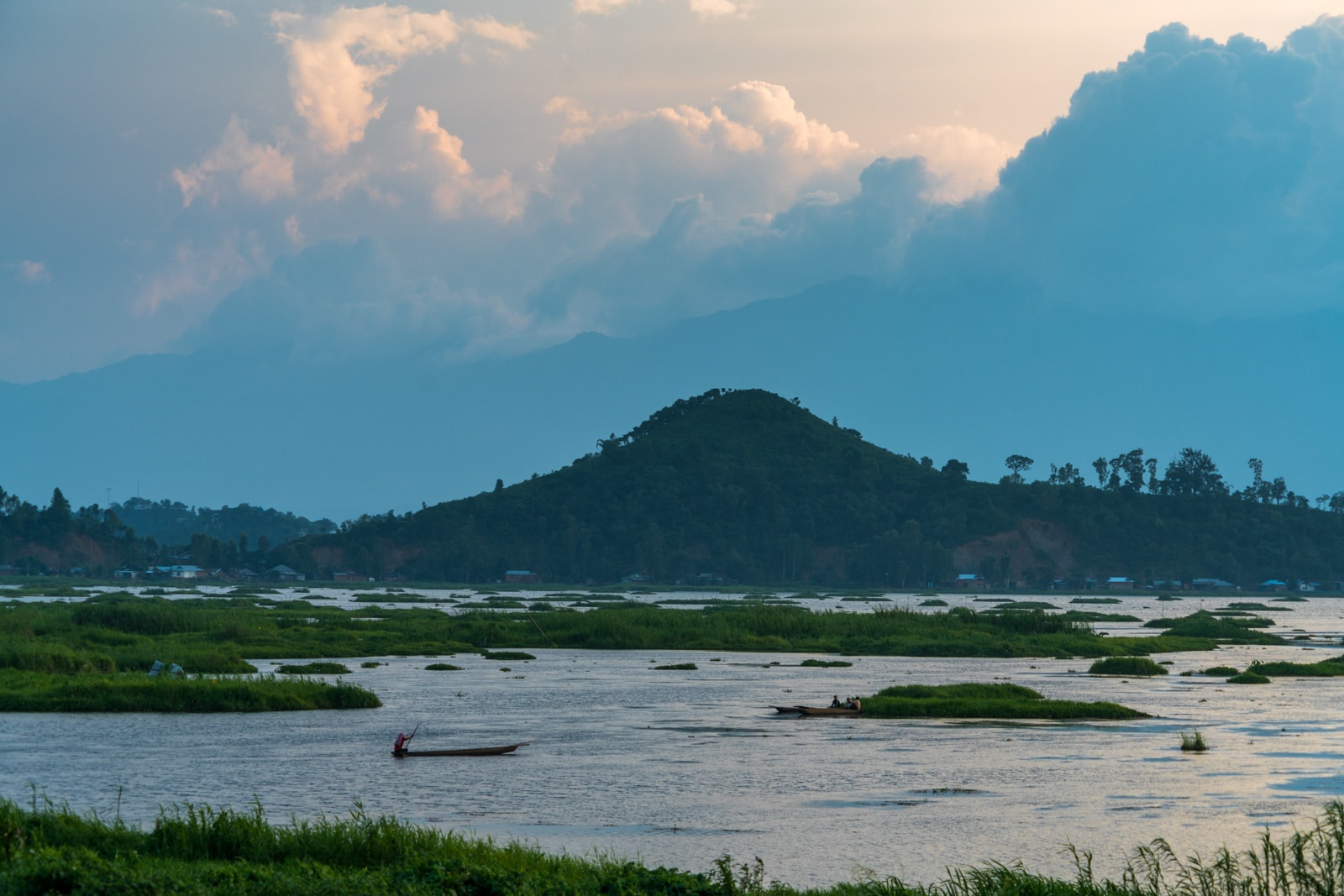 Why you need to visit Loktak Lake, Manipur, Northeast India - Fisherman boating at sunset - Lost With Purpose