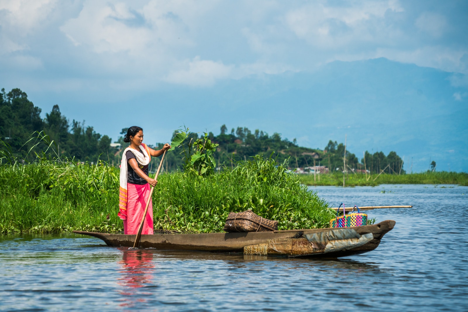 Why you need to visit Loktak Lake, Manipur, Northeast India - Woman on boat - Lost With Purpose