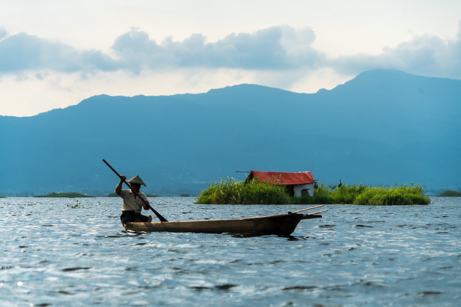 Why you need to visit Loktak Lake, Manipur, Northeast India - Fisherman and red hut on the lake - Lost With Purpose