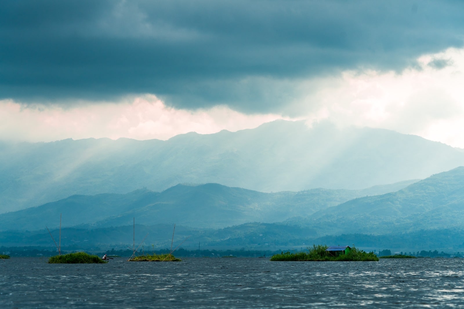 Why you need to visit Loktak Lake, Manipur, Northeast India - Sun rays hitting a fisherman's hut - Lost With Purpose