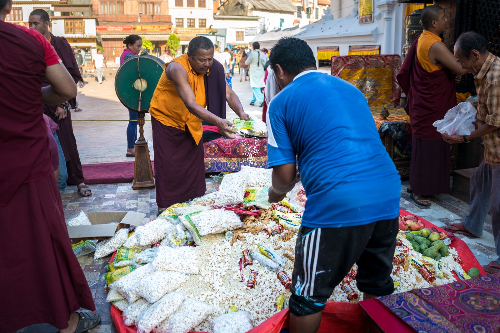 Traveling during monsoon in Nepal - Food donations at Boudhanath temple in Kathmandu - Lost With Purpose travel blog