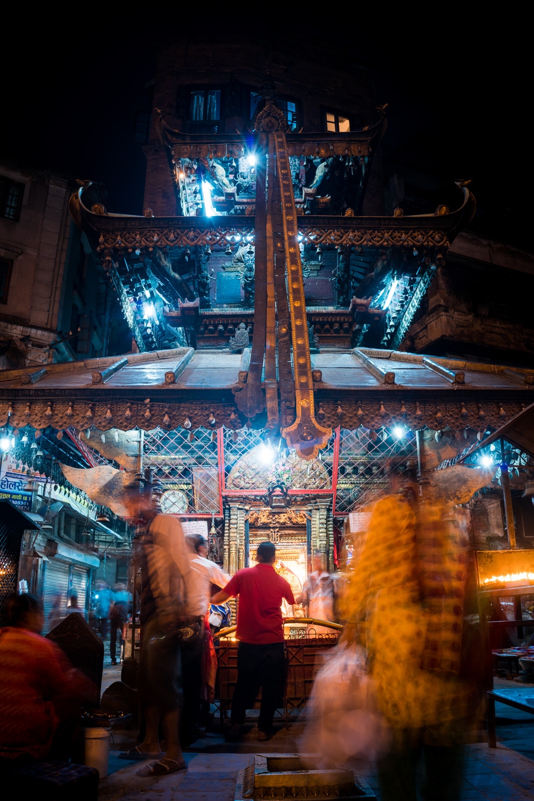 Nighttime activity at one of many Buddhist temples on the streets of Kathmandu, Nepal.