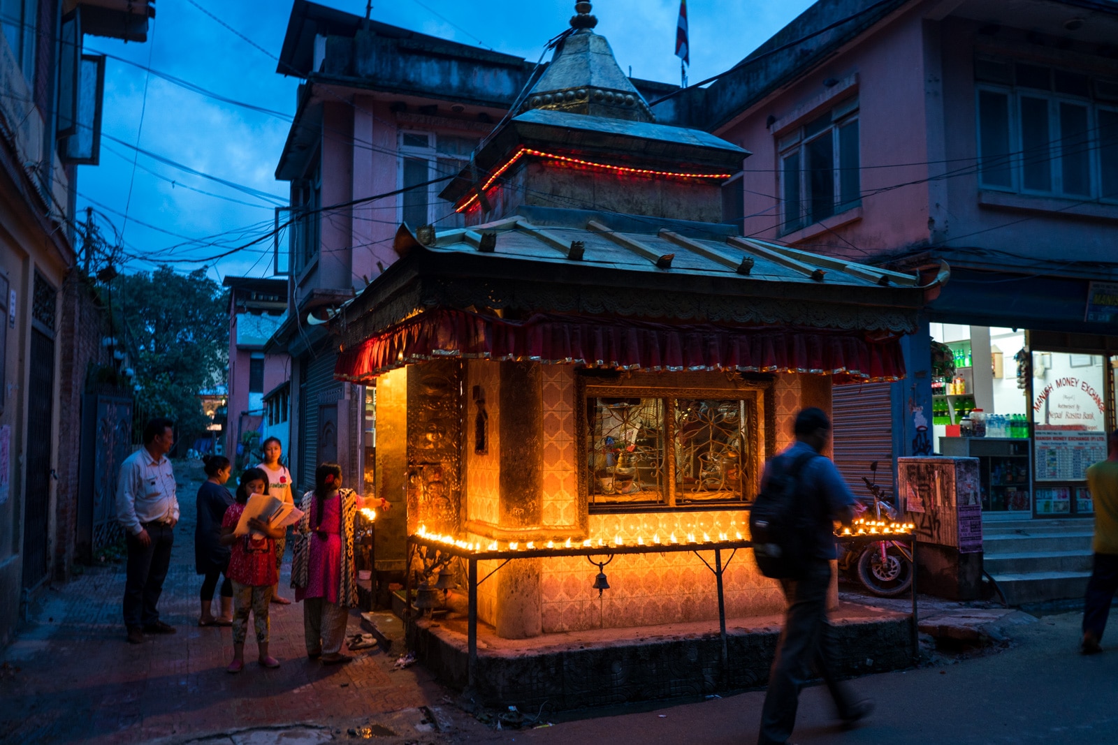 Traveling during Nepal in monsoon - Small Buddhist shrine on the streets of Kathmandu - Lost With Purpose travel blog