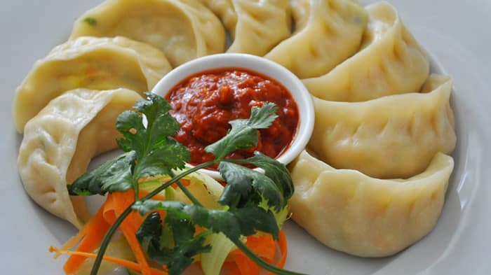 A plate of steamed Tibetan momos - Top 5 must-eat delicacies in Lhasa, Tibet