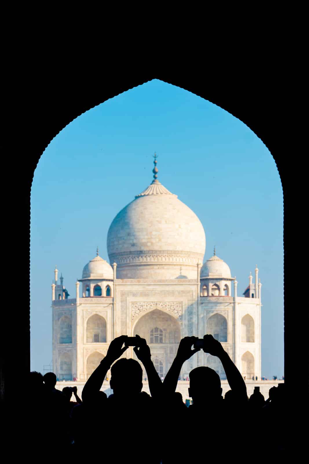 Tourists with cameras at the Taj Mahal in Agra, India.