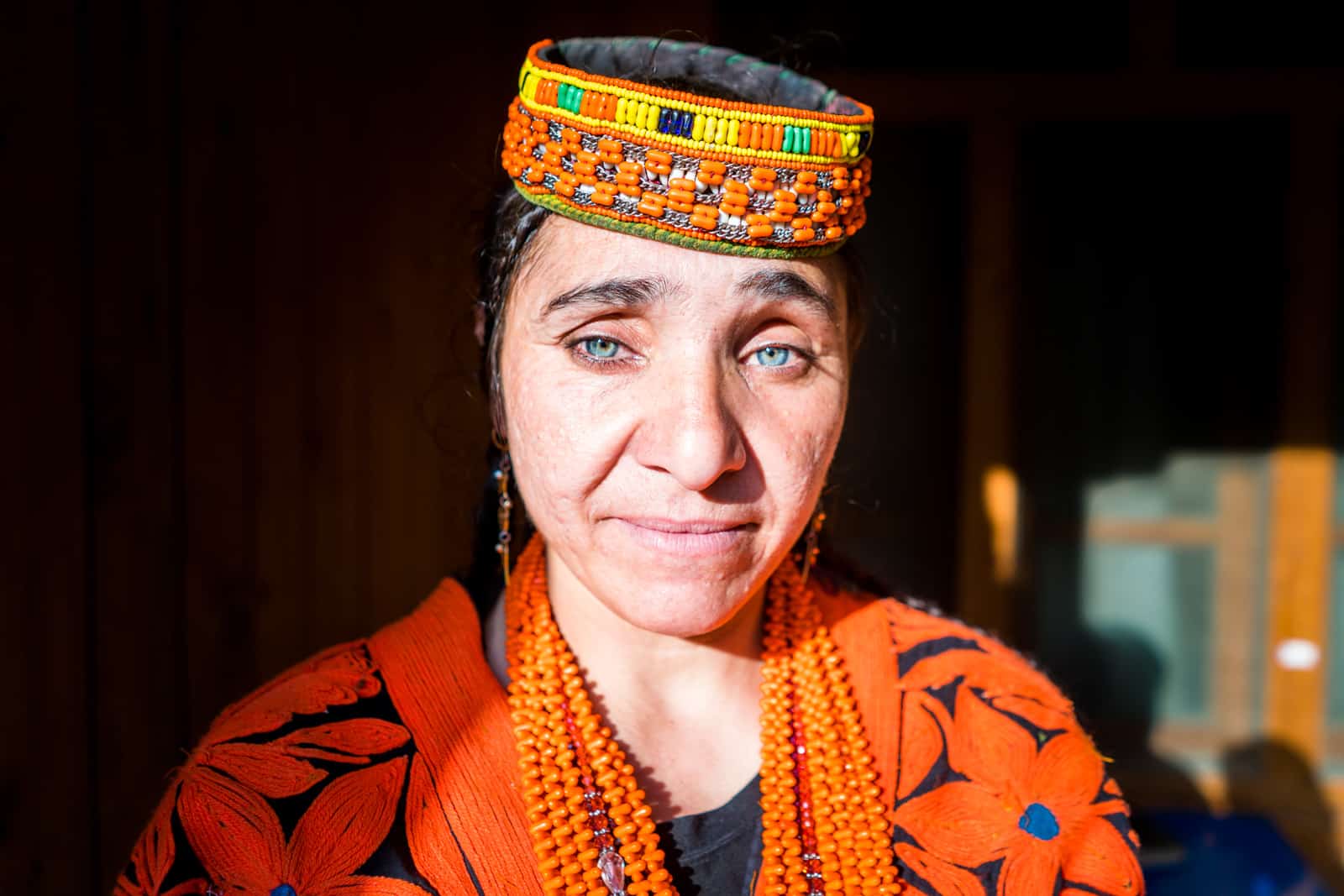 Kalasha woman with blue eyes in traditional outfit