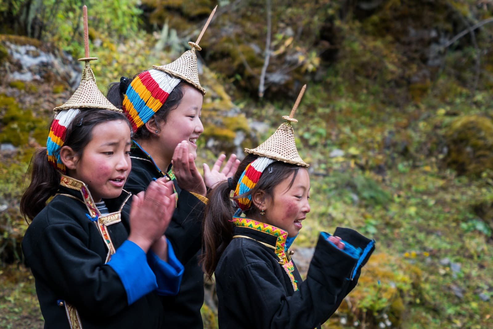 Photos of the Royal Highlander Festival in Bhutan - Local Layap girls cheering on Snowman Run participants - Lost With Purpose travel blog