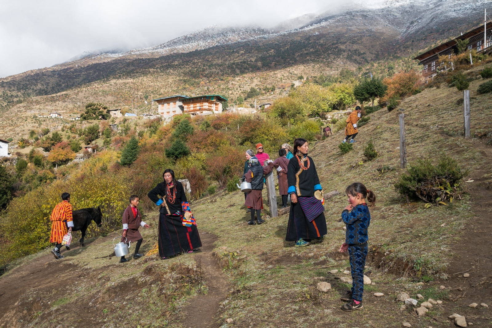 Photos of the 2017 Royal Highlander Festival in Bhutan - Locals trekking up to the Laya festival grounds - Lost With Purpose travel blog