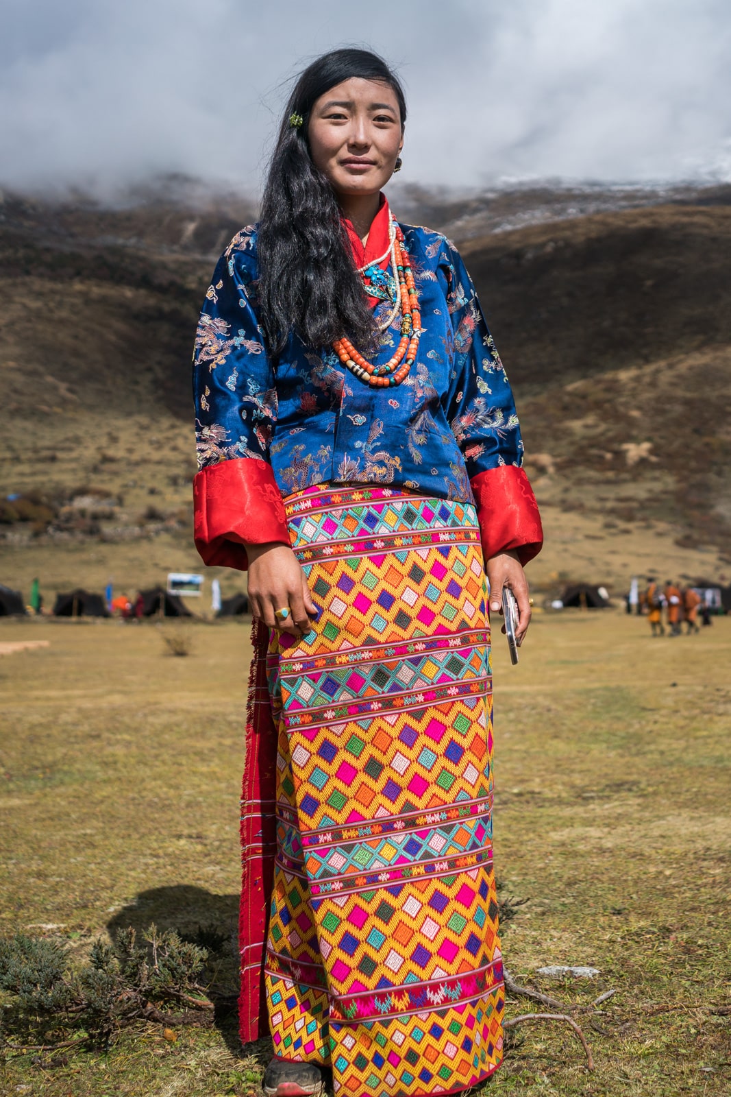 These colors are goals! A girl in a beautiful patterned "kira", traditional female Bhutanese dress, at the 2017 Royal Highlander Festival in Bhutan.