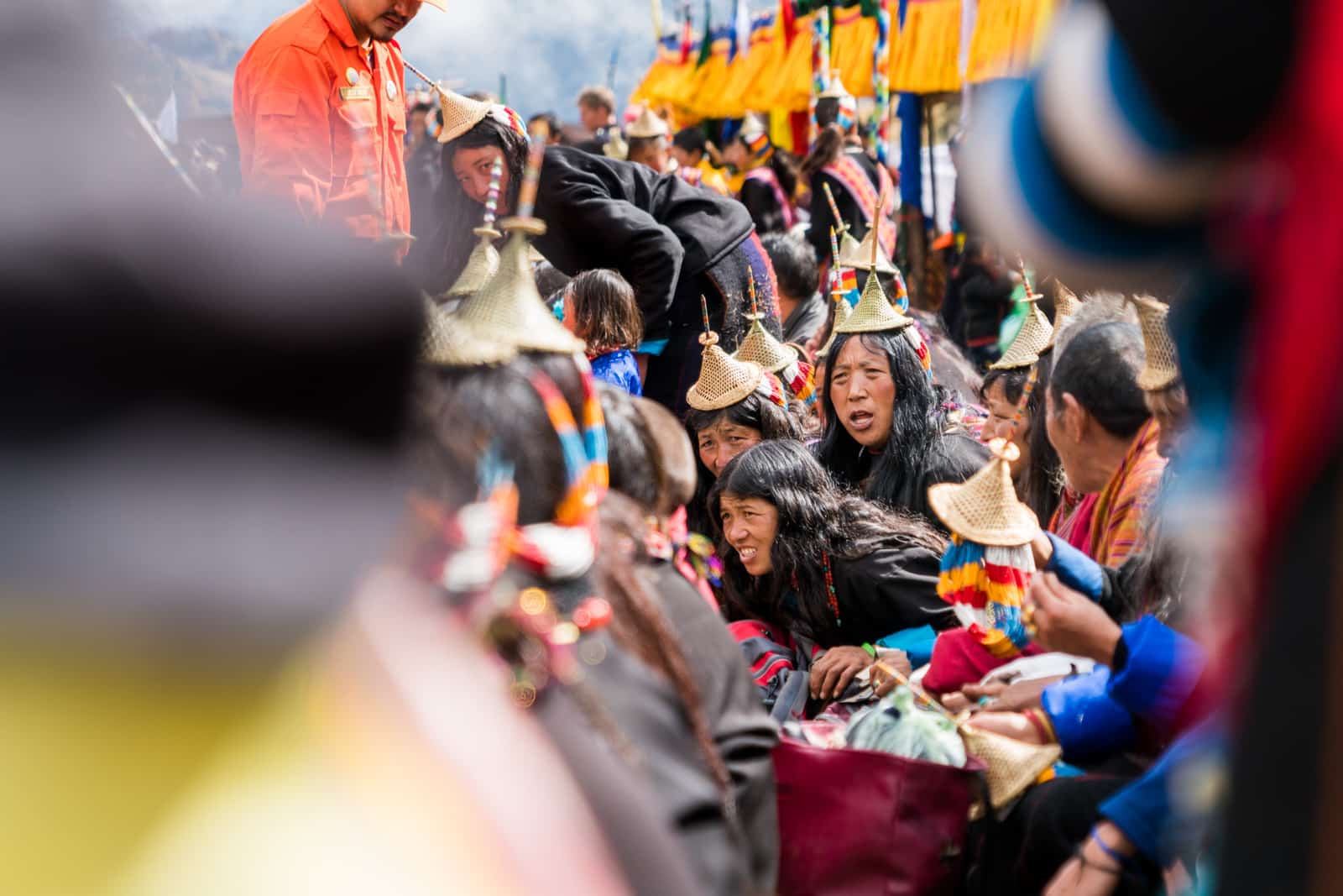 Photos of the 2017 Royal Highlander Festival in Bhutan - Local Layap ladies shouting in the crowd - Lost With Purpose travel blog