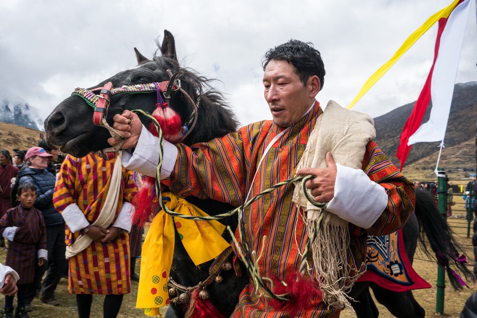 Photos of the 2017 Royal Highlander Festival in Laya, Bhutan - Man showing his horse - Lost With Purpose travel blog